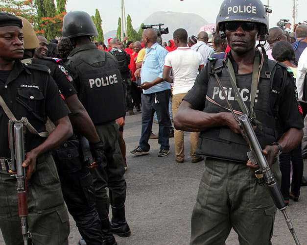 ABUJA, NIGERIA - MAY 22: Police officers stand guard during a demonstration that Nigerians demand release of Nigerian school girls who were kidnapped by extremist militants Boko Haram in capital Abuja, Nigeria on May 22, 2014. The protesters called for the safe return of the girls and for the Nigerian government to play a more active role in helping to return the girls to their families. (Photo by Nacer Talel/Anadolu Agency/Getty Images)