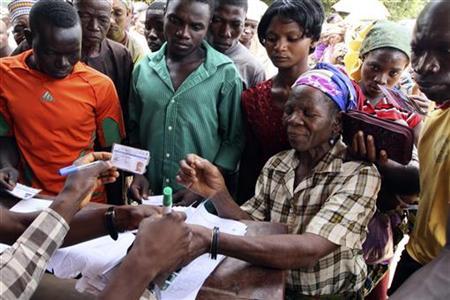 A woman's thumb is marked after verifying that she has a voter's card during parliamentary elections in Suleja, Niger state April 9, 2011.