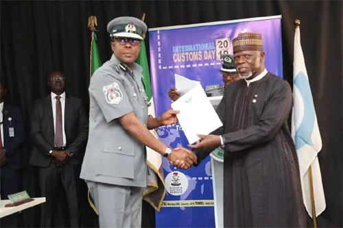 Comptroller Bashir Receiving The Wco Award Of Exceptional Performance For Apapa Command, From Cgc Ali Hameed